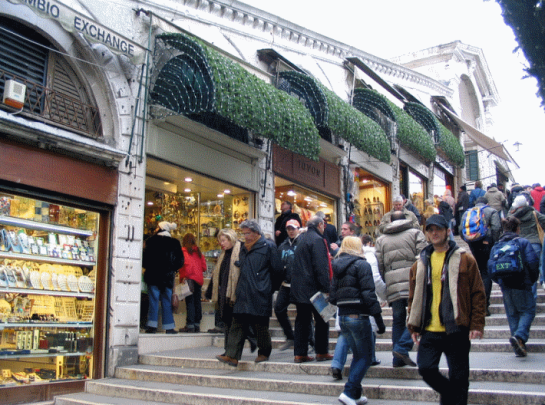 The inner street on Rialto Bridge. Many tourist shops, but they won't let you see the Grand Canal...
