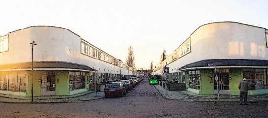 The entrance to the neighborhood, with the two shops