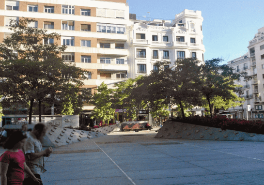 The trees on the western part of the square. The "plugs" on the sloped granite are a "solution" against damage by skaters.