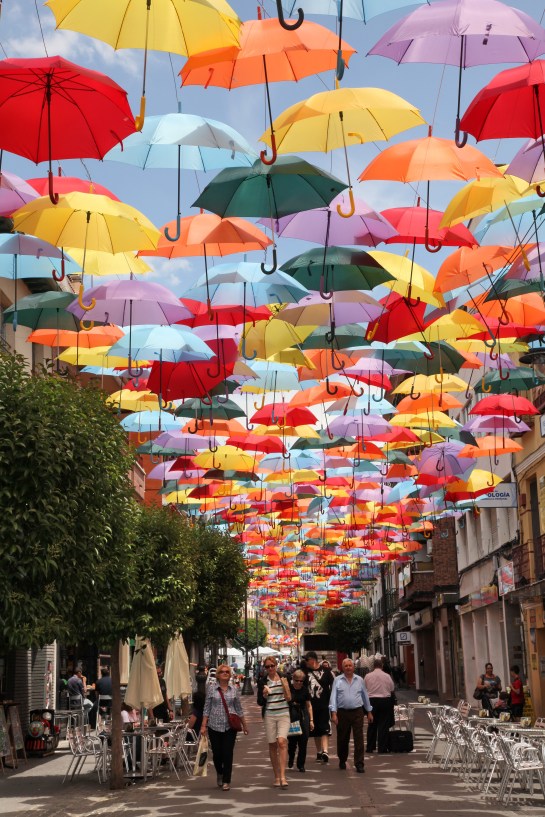 The Getafe Umbrellas, as seen on the municipal website http://getafe.es/la-calle-madrid-se-cubre-de-paraguas-de-colores-para-potenciar-el-comercio-de-la-zona-centro/