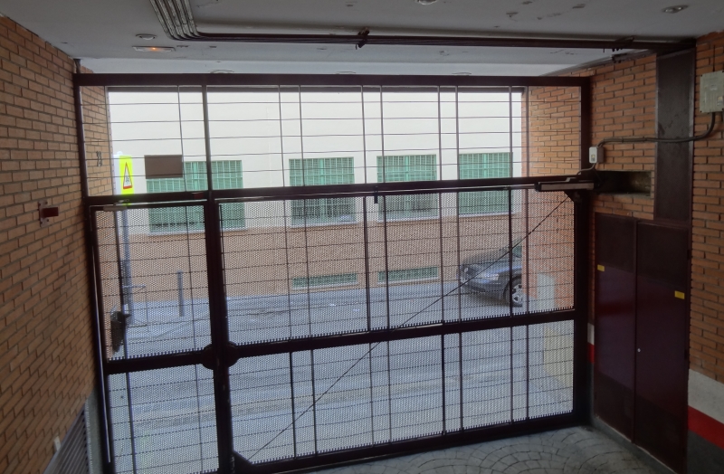 A garage door in a small appartment building in Spain